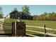 Beautiful brick home with well-manicured lawn and gated entrance, offering a secure and private setting at 1370 Null Rd, Lincolnton, NC 28092