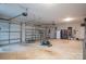 Spacious three car garage with a fridge, work-out equipment and ample storage space at 1370 Null Rd, Lincolnton, NC 28092