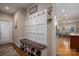 Mudroom features a bench, cubbies, coat hooks, hardwood floors, and access to the laundry room and kitchen at 1370 Null Rd, Lincolnton, NC 28092