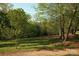 Scenic landscape showcasing open land, mature trees and natural beauty at 1370 Null Rd, Lincolnton, NC 28092