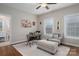 Bright office space with a large desk, chair, and ottoman at 1370 Null Rd, Lincolnton, NC 28092
