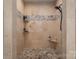 Shower with neutral tile, mosaic accents, and built-in shelving at 1370 Null Rd, Lincolnton, NC 28092