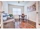 Home office with hardwood floors, built-in shelving, and large window at 15618 Aviary Orchard Way, Charlotte, NC 28278