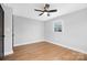 Well-lit bedroom featuring hardwood floors and a window at 1740 Northcliff Dr, Charlotte, NC 28216