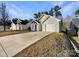 House exterior featuring a gray facade and a driveway at 1817 Duke Adam St, Kannapolis, NC 28083