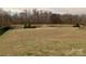 Landscaped community pond with fountain and seating area at 1916 Seefin Ct, Indian Trail, NC 28079