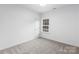 Simple bedroom with carpet and a window at 5517 Skycrest Dr, Charlotte, NC 28269