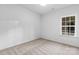 Simple bedroom with carpet and a window at 5517 Skycrest Dr, Charlotte, NC 28269