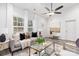 Spacious living room with hardwood floors, neutral decor and ceiling fan at 5517 Skycrest Dr, Charlotte, NC 28269