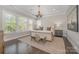 Serene bedroom with a neutral color palette, plush bed, and ample natural light at 636 Bucks Quarry Ct, Fort Mill, SC 29708