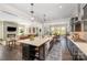 Open concept kitchen with a large island, and views into the living room and dining room at 636 Bucks Quarry Ct, Fort Mill, SC 29708