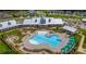 Resort-style pool and clubhouse with ample seating and umbrellas at 7029 Overjoyed Xing, Charlotte, NC 28215