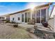 Charming backyard with a patio, sunroom, and landscaping at 7029 Overjoyed Xing, Charlotte, NC 28215