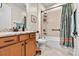 Clean bathroom with tub shower combo and granite countertop at 7029 Overjoyed Xing, Charlotte, NC 28215