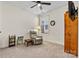 Cozy bedroom with sitting area and ample natural light at 7029 Overjoyed Xing, Charlotte, NC 28215