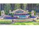 Impressive entrance to Cresswind community featuring a water fountain and landscaping at 7029 Overjoyed Xing, Charlotte, NC 28215