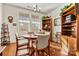 Sun-drenched dining area with hardwood floors and a round table at 7029 Overjoyed Xing, Charlotte, NC 28215