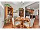 Bright dining area with hardwood floors and kitchen view at 7029 Overjoyed Xing, Charlotte, NC 28215