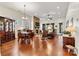 Bright dining room with hardwood floors and stone fireplace at 7029 Overjoyed Xing, Charlotte, NC 28215