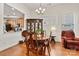 Elegant dining room adjacent to kitchen, featuring hardwood floors at 7029 Overjoyed Xing, Charlotte, NC 28215
