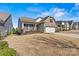 Ranch style home with stone accents and landscaping at 7029 Overjoyed Xing, Charlotte, NC 28215