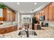Kitchen boasts granite countertops, stainless steel appliances, and hardwood floors at 7029 Overjoyed Xing, Charlotte, NC 28215