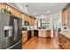 Modern kitchen with stainless steel appliances and wood cabinets at 7029 Overjoyed Xing, Charlotte, NC 28215