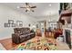 Open living room with hardwood floors, stone fireplace and recessed lighting at 7029 Overjoyed Xing, Charlotte, NC 28215