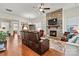 Relaxing living room featuring hardwood floors and a cozy fireplace at 7029 Overjoyed Xing, Charlotte, NC 28215