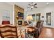 Living room with stone fireplace, hardwood floors, and access to patio at 7029 Overjoyed Xing, Charlotte, NC 28215