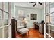 Bright home office with built-in shelving and hardwood floors at 7029 Overjoyed Xing, Charlotte, NC 28215