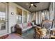 Cozy sunroom featuring a wicker sofa and rocking chair at 7029 Overjoyed Xing, Charlotte, NC 28215