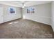 Spacious main bedroom with neutral walls and carpet at 801 Crestridge Rd, Statesville, NC 28677