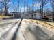 Newly renovated house with a gray garage door and a spacious yard at 801 Crestridge Rd, Statesville, NC 28677