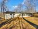 Back of house showing sunroom and private backyard at 801 Crestridge Rd, Statesville, NC 28677
