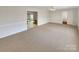 Open living room with carpeted floors and access to the kitchen at 801 Crestridge Rd, Statesville, NC 28677