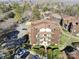 Aerial view of condo building and surrounding landscape at 8103 Cedar Glen Dr, Charlotte, NC 28212