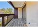 Private balcony with wooden deck and wooded views at 8103 Cedar Glen Dr, Charlotte, NC 28212