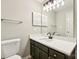 Modern bathroom with dark vanity, white countertop, and updated fixtures at 8103 Cedar Glen Dr, Charlotte, NC 28212