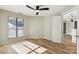Spacious bedroom with wood flooring and access to a balcony at 8103 Cedar Glen Dr, Charlotte, NC 28212