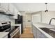Updated kitchen with stainless steel appliances and marble backsplash at 8103 Cedar Glen Dr, Charlotte, NC 28212