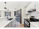 Modern kitchen featuring stainless steel appliances and white cabinetry at 8103 Cedar Glen Dr, Charlotte, NC 28212