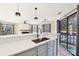 Modern kitchen features stainless steel appliances and white quartz countertops at 8103 Cedar Glen Dr, Charlotte, NC 28212