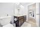 Double vanity bathroom with dark brown cabinets and a shower at 8219 Pamplin Ct, Charlotte, NC 28273