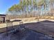 Spacious backyard with patio and wooded backdrop at 8825 Chapel Grove Crossing Dr, Huntersville, NC 28078
