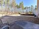 Large backyard featuring a patio and private wooded area at 8825 Chapel Grove Crossing Dr, Huntersville, NC 28078