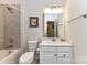 Clean bathroom with tub, shower, and vanity at 8825 Chapel Grove Crossing Dr, Huntersville, NC 28078