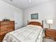 Cozy bedroom featuring a double bed, dresser, and nightstand at 8825 Chapel Grove Crossing Dr, Huntersville, NC 28078
