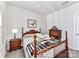 Simple bedroom with wood bed frame and window at 8825 Chapel Grove Crossing Dr, Huntersville, NC 28078