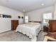Cozy bedroom with wood furniture and carpeted floor at 8825 Chapel Grove Crossing Dr, Huntersville, NC 28078